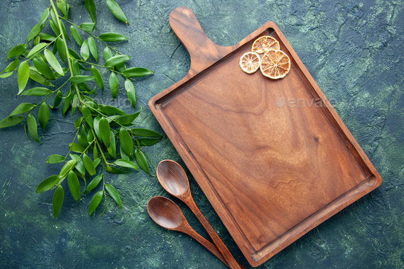 top view wooden spoons with brown desk on a dark blue background food color meat kitchen ancient