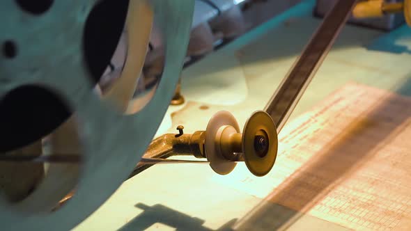 Film Reel with Retro Movie Moved By Vintage Cinema Tools alt