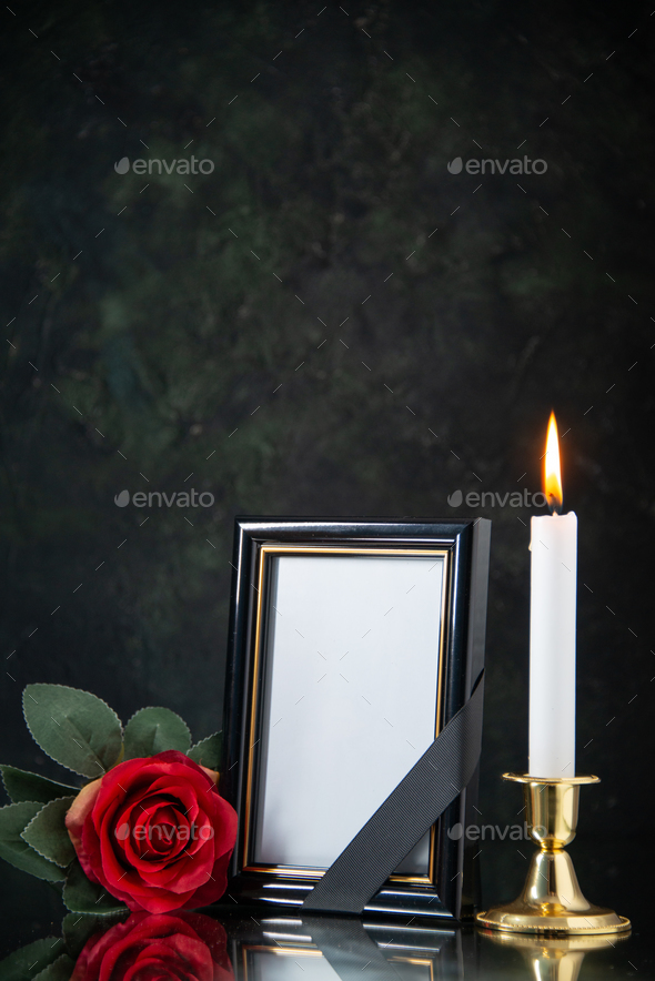 front view of burning candle with red flower on black background evil death  funeral war Stock Photo by AydinovKamran