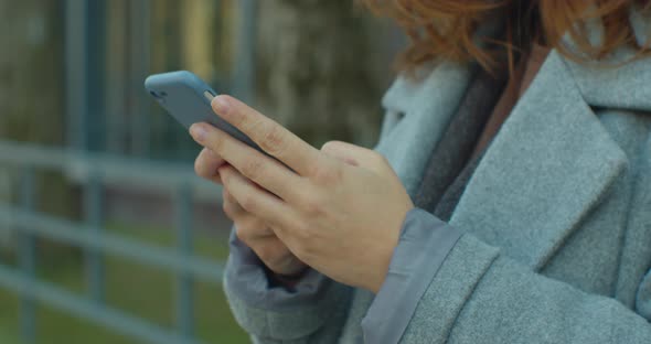 Closeup of Woman Typing on Phone alt