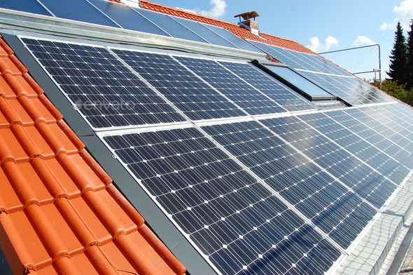 photovoltaic system, solar cells and solar thermal panels on a roof
