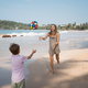 Happy mother and son playing ball at beach in summer sunny day - PhotoDune Item for Sale