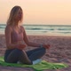 Woman Practice Yoga Lotus Pose to Meditation with Summer Vacation Beach Happiness and Relaxation - VideoHive Item for Sale