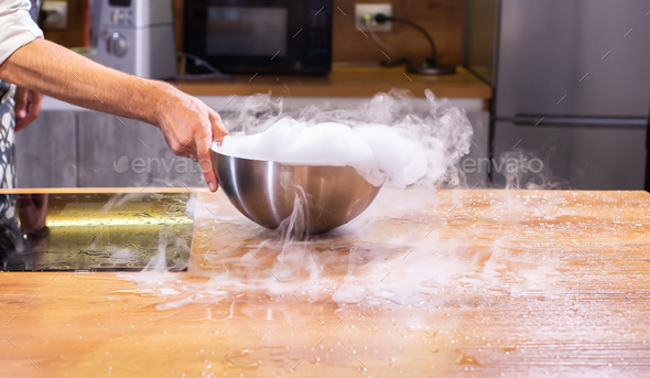 Smoke vapor dry ice in bowl in kitchen