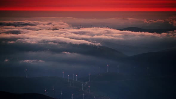 Wind Turbines at Sunset above Clouds. Portugal.