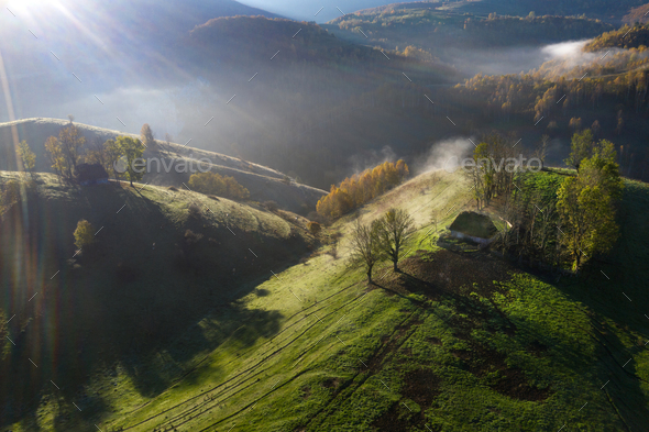 Mountain countryside homestead in the autumn. Wooden barns, aerial drone view - Stock Photo - Images