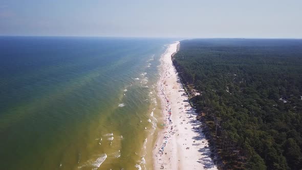 Drone footage of a sandy beach, sunny summer day, Baltic Sea, Poland, Lubiatowo. alt
