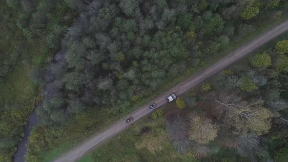 SUVs Go Through the Forest