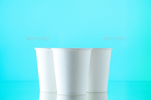 front view paper water cups on sky blue background Stock Photo by ...
