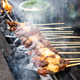 Closeup of chicken satay being barbecue with traditional pit and fired with charcoal - PhotoDune Item for Sale