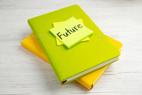 front view future note on sticker with copybooks on white background work color job motivation
