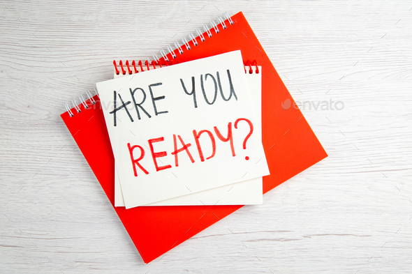 top view are you ready motivation note with red copybook on the white background color job regime