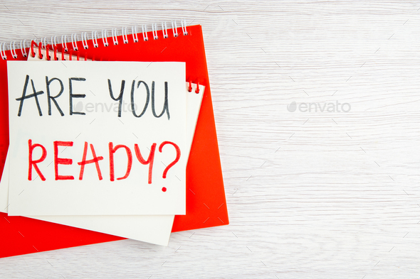 top view are you ready motivation note with red copybook on white background color job regime