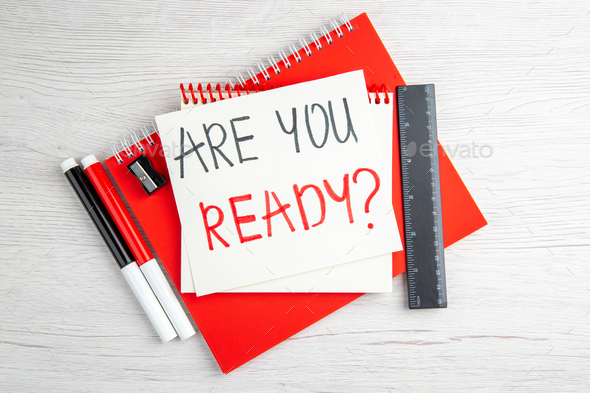 top view are you ready motivation note with red copybook on white background color job regime