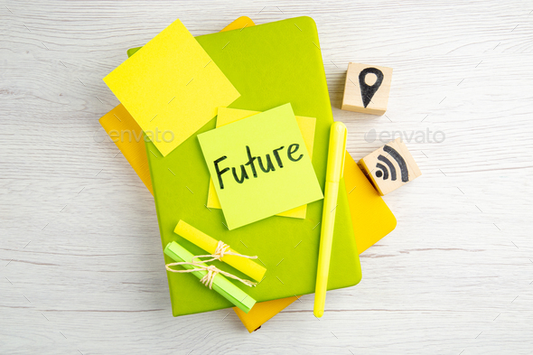 top view future note on sticker with copybooks on white background drawing work color job motivation