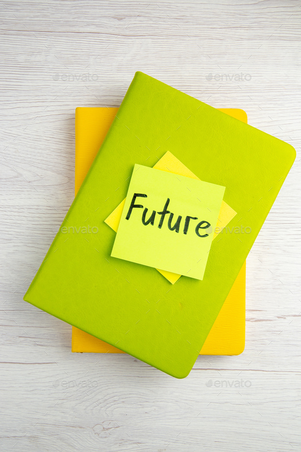 top view future note on sticker with copybooks on white background work color job motivation drawing