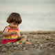 Toddler baby playing on a beach - PhotoDune Item for Sale