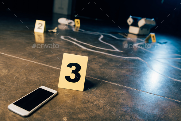 chalk outline, smartphone with blank screen and evidence markers at crime scene