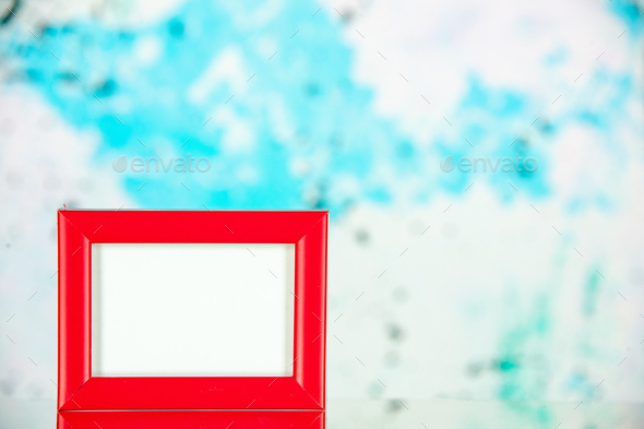 front view red picture frame on light blue background shoot family colors  present picture photo Stock Photo by ImgSolut
