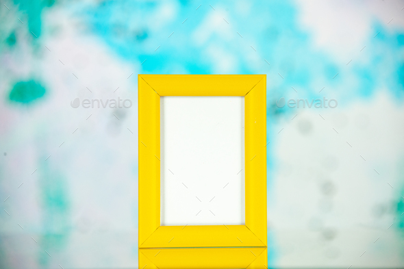 front view yellow picture frame on a light blue background portrait photo color shoot present family