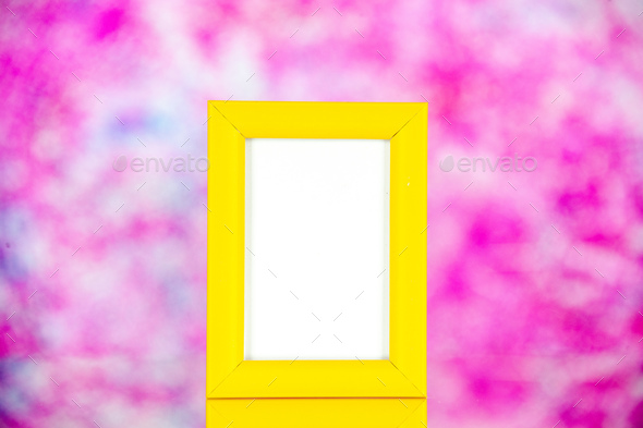 front view yellow picture frame on a light pink background portrait photo color shoot present family
