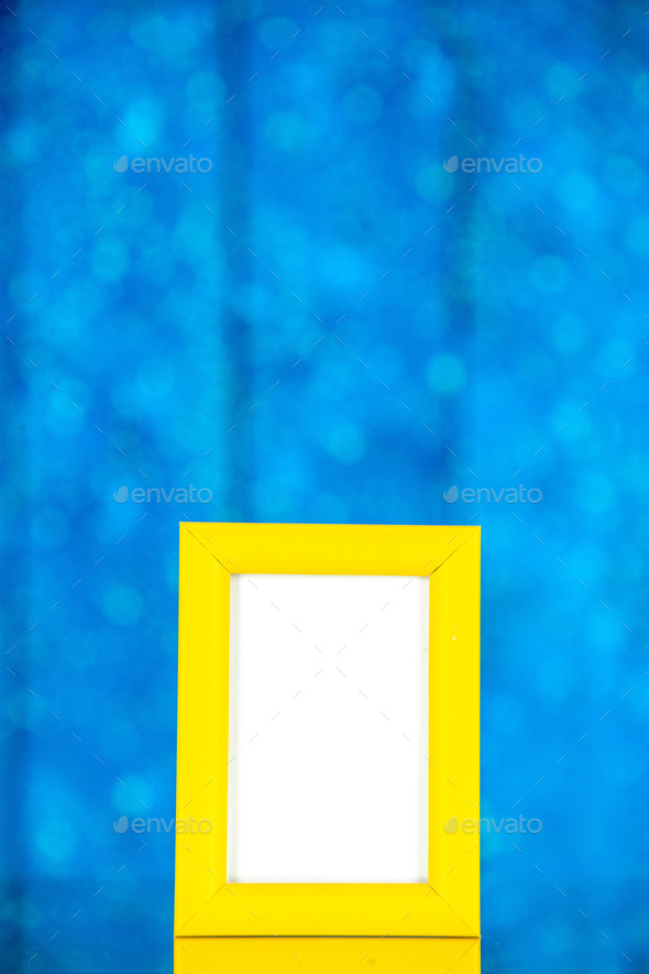 front view yellow picture frame on blue background portrait photo color shoot present family gift
