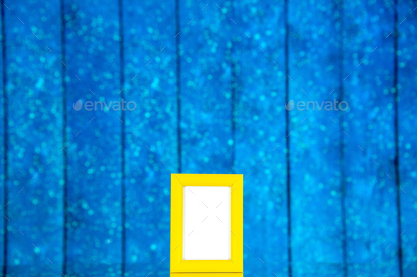 front view yellow picture frame on blue background portrait photo color shoot present family gifts