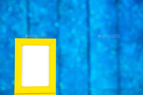 front view yellow picture frame on blue background portrait photo color shoot present family gifts