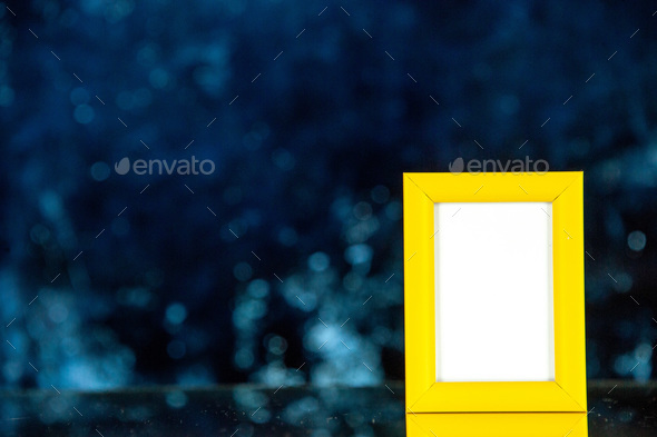 front view yellow picture frame on dark background shoot picture gift photo present colors portrait