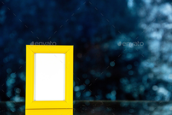 front view yellow picture frame on dark background shoot picture gift photo presents color portrait