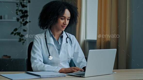 African woman doctor physician student of medical university intern psychotherapist use laptop