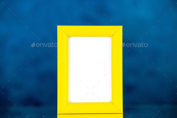 front view yellow picture frame on dark blue background picture family gift photo present shoot