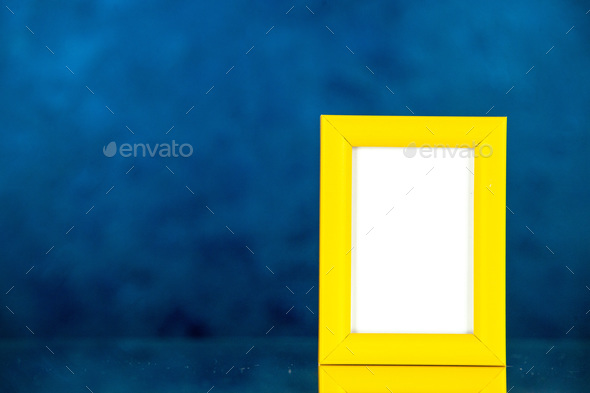 front view yellow picture frame on dark blue background picture family gift photo presents shoot