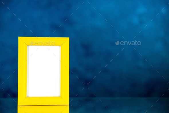 front view yellow picture frame on dark blue background picture family gift photo present shoot