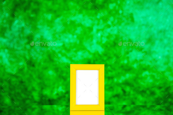 front view yellow picture frame on green background color shoot picture gift present portrait family