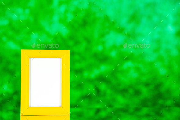 front view yellow picture frame on green background color shoot picture gift present portrait family