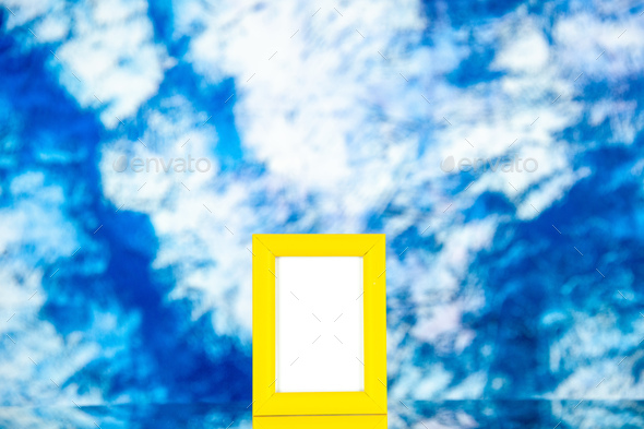 front view yellow picture frame on light blue background portrait photo color shoot present family