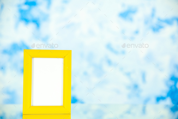 front view yellow picture frame on light-blue background portrait photo color shoot present family