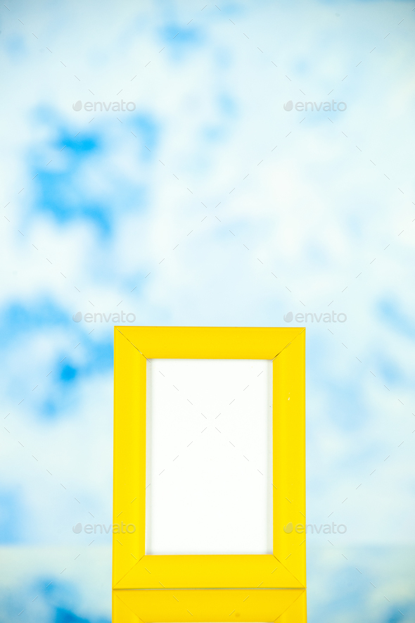 front view yellow picture frame on light-blue background portrait photo shoot present family gift