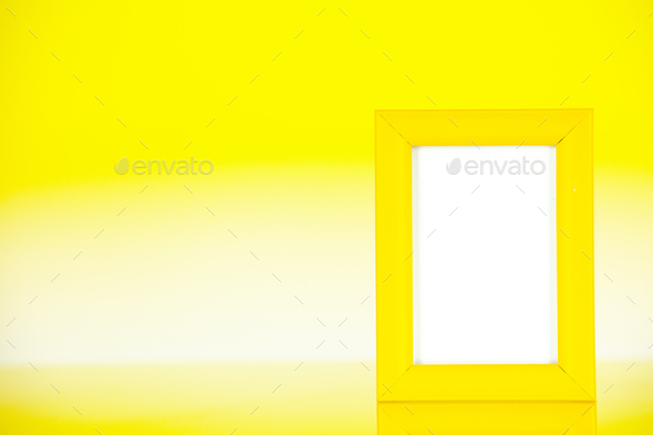 front view yellow picture frame on yellow background family color gift present portrait photo shoot