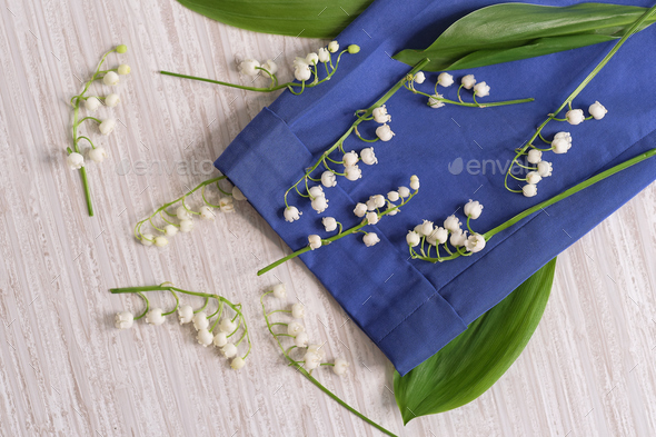 flowers, and clothes on a wooden background. Concept for organic, recycled