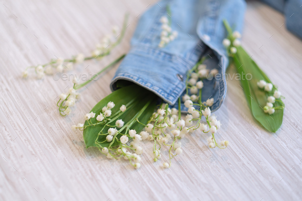 flowers, and clothes on a wooden background. Concept for organic, recycled