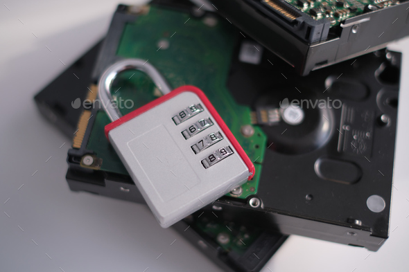 Encrypted hard disk. Padlock with cipher on an opened hard disk. Stock ...