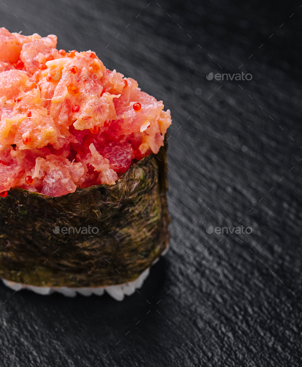 Gunkan Maki Sushi of fish salmon, scallop, perch, eel, shrimp and