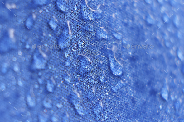 water beading on fabric. Waterproof coating background with water drops