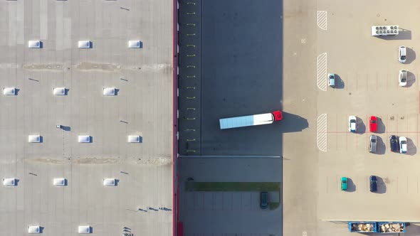 Aerial View of Loading Warehouse with Semi Truck. Aerial alt