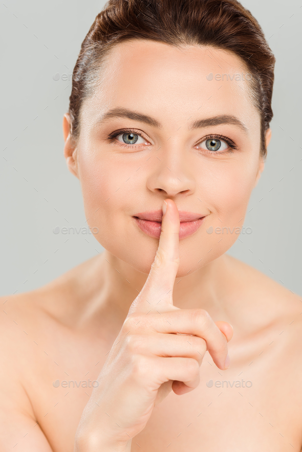 Happy Naked Woman Showing Hush Sign And Smiling Isolated On Grey Stock Photo By LightFieldStudios