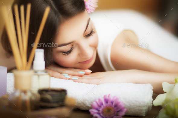 Skin Care. Spa treatments. Flower in hair. The concept of beauty and health. In the massage salon.