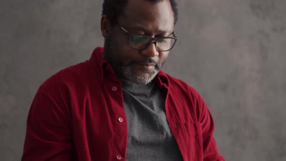 Serious man working with papers alt