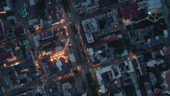 Partially Lit City Blocks In The Evening Aerial With Car Traffic Lights